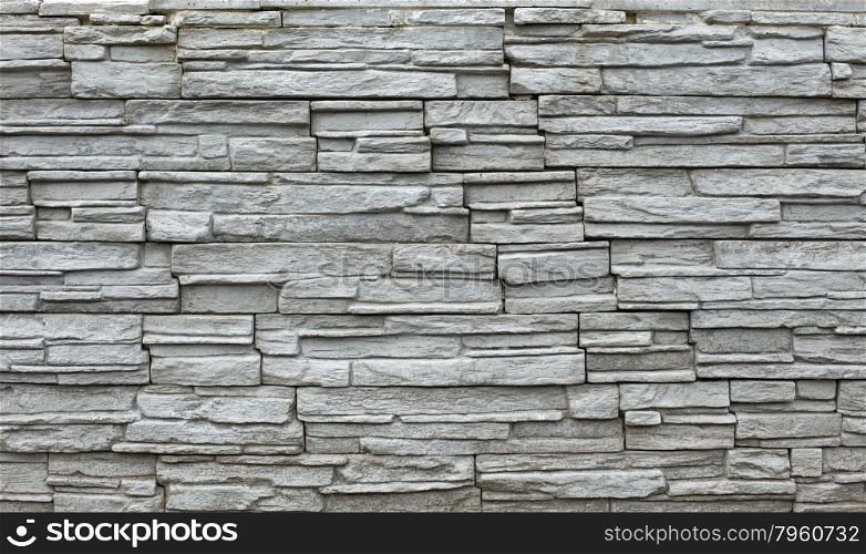 Close up of a grey stone wall