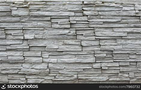 Close up of a grey stone wall