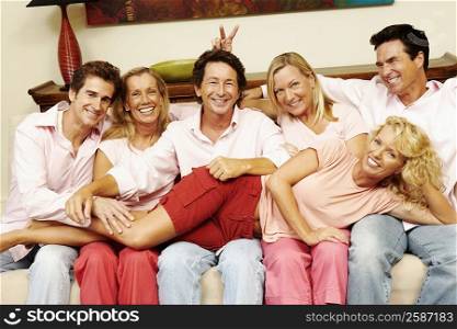 Close-up of a group of people sitting together on a couch