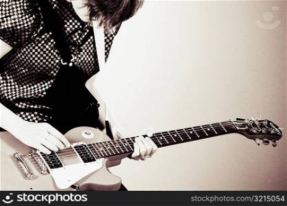 Close-up of a guitarist playing a guitar