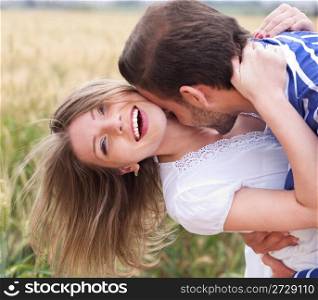 Close up of a Happy young Couple kissing in the park