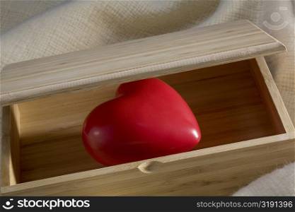Close-up of a heart in a wooden box