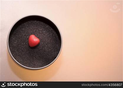 Close-up of a heart shaped candy in a bowl
