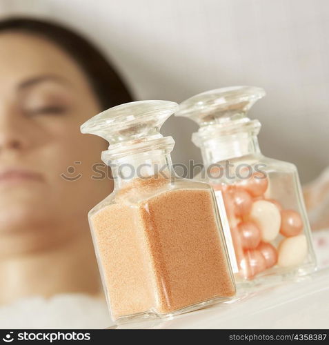 Close-up of a herbal medicine and pearls in a jar