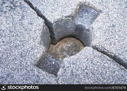 Close-up of a hole cut out in a rock surface