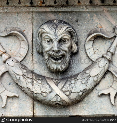 Close-up of a human face carved on a wall, Bergen, Norway