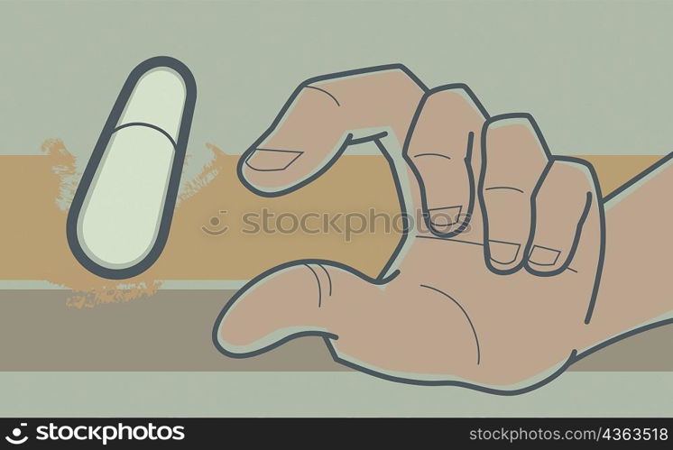 Close-up of a human hand and a capsule