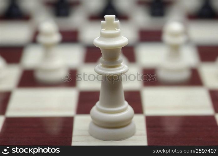 Close-up of a king chess piece on a chessboard