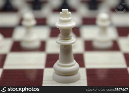 Close-up of a king chess piece on a chessboard