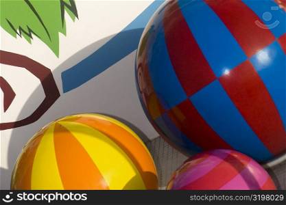 Close-up of a knob and balls on a multi-colored wall