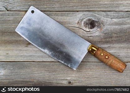 Close up of a large old traditional butcher knife on rustic wood &#xA;&#xA;