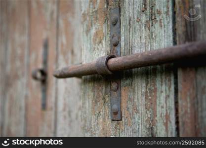 Close-up of a latch on a wooden door