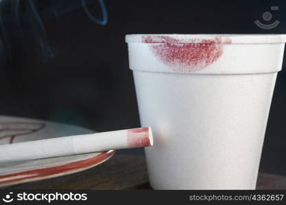 Close-up of a lipstick mark on a disposable cup