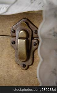 Close-up of a lock on a wooden box