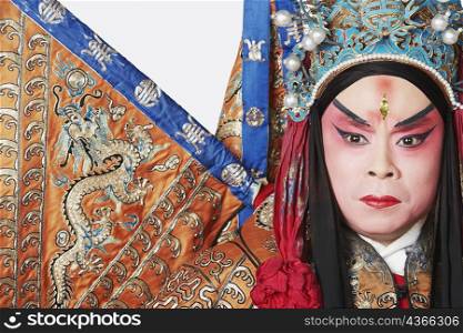 Close-up of a male Chinese opera performer looking serious