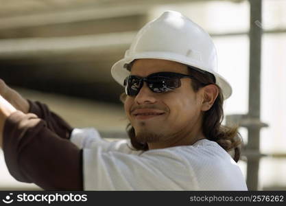 Close-up of a male construction worker smiling