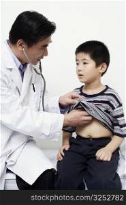 Close-up of a male doctor examining a child