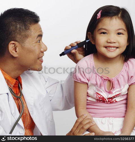 Close-up of a male doctor examining his patient