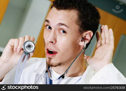 Close-up of a male doctor listening with a stethoscope