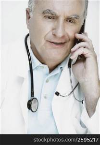 Close-up of a male doctor talking on a mobile phone