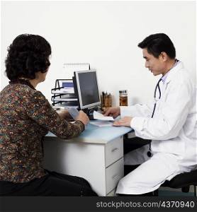 Close-up of a male doctor with a patient in his office