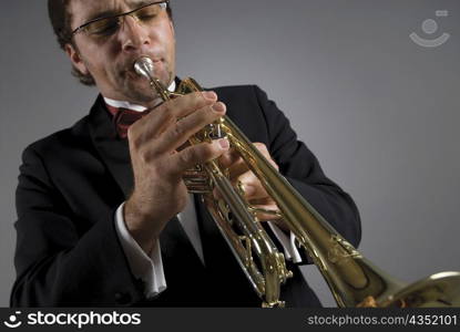 Close-up of a male musician playing a trumpet