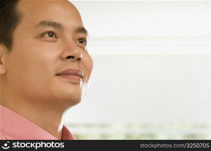Close-up of a male office worker contemplating