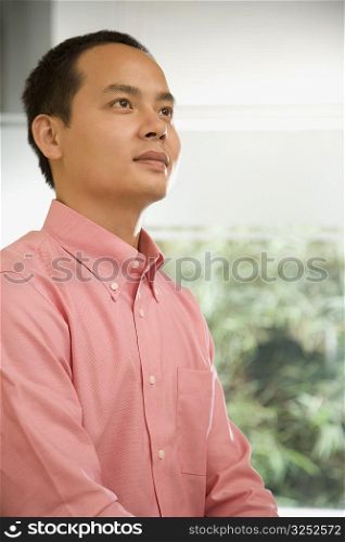 Close-up of a male office worker contemplating