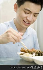 Close-up of a male office worker having lunch