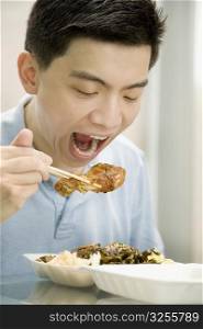 Close-up of a male office worker having lunch