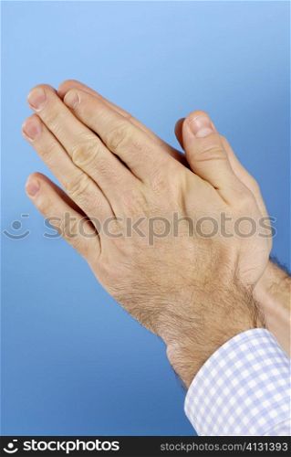 Close-up of a man&acute;s hands in a prayer position