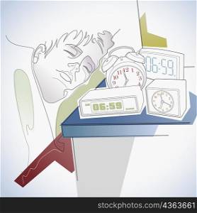 Close-up of a man sleeping with assorted alarm clocks