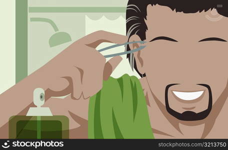 Close-up of a man tweezing his eyebrows