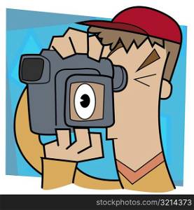 Close-up of a man using a video camera