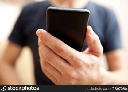 Close up of a man using mobile smart phone