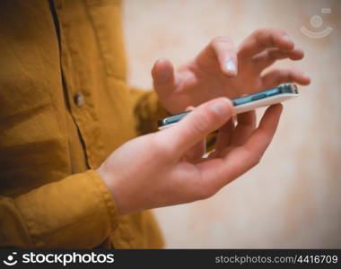 Close up of a man using mobile smart phone