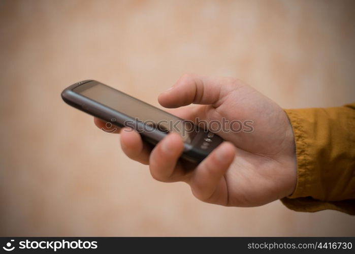 Close up of a man using mobile smart phone