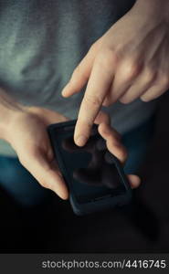 Close up of a man using mobile smart phone