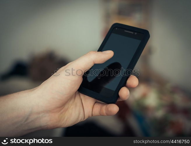 Close up of a man using mobile smart phone