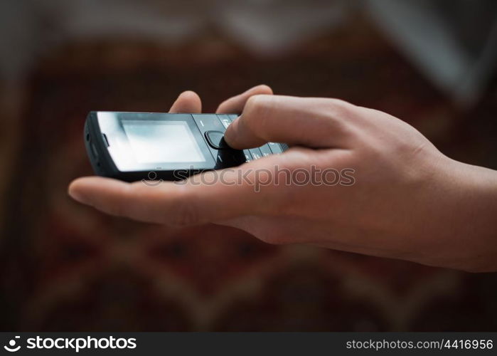 Close up of a man using mobile smart phone