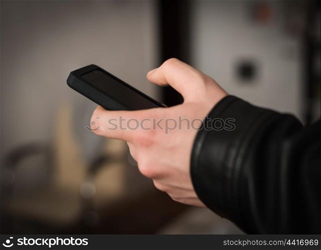 Close up of a man using mobile smart phone