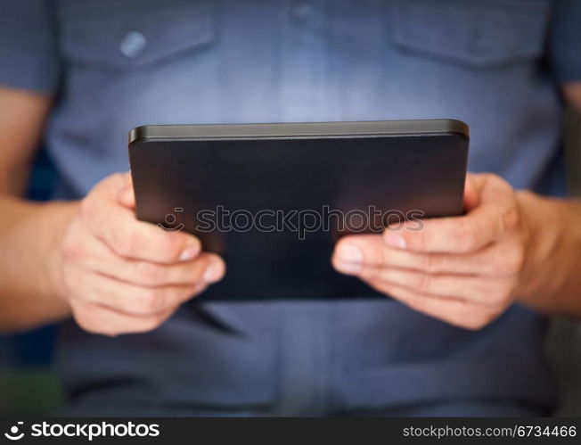 Close up of a man using tablet pc, small dof