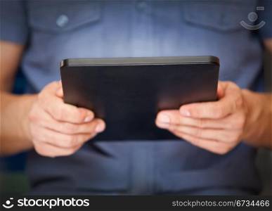 Close up of a man using tablet pc, small dof