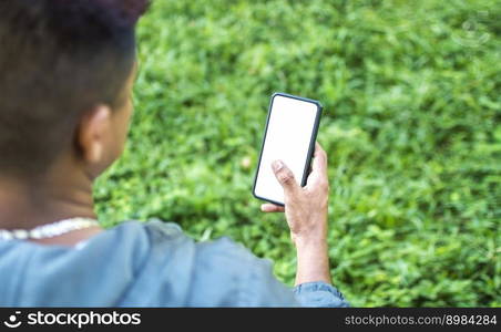 Close up of a man with cell phone in hand, close up of hands with cell phone with white screen, young guy with cell phone in hand with copy space