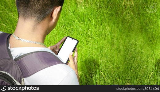 Close up of a man with cell phone in hand, close up shot of a person checking his cell phone, young guy with cell phone in hand with copy space