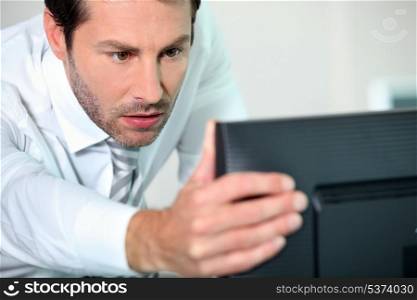 close-up of a man with computer
