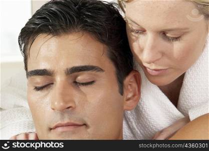 Close-up of a massage therapist with a young man