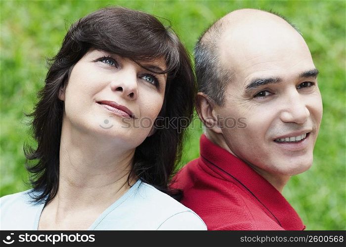 Close-up of a mature couple back to back