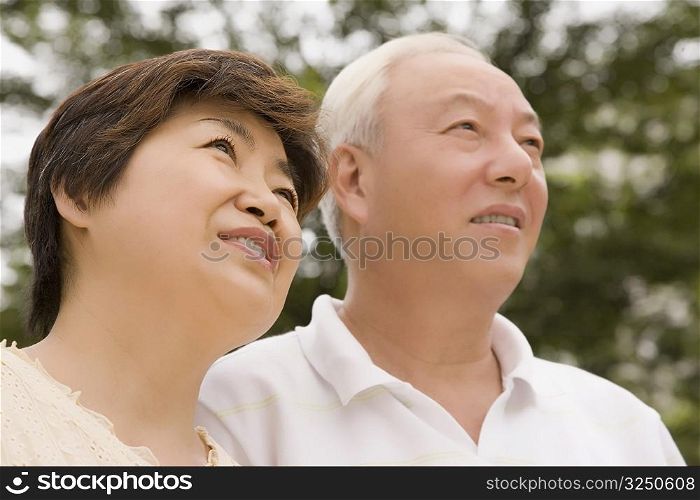 Close-up of a mature couple day dreaming