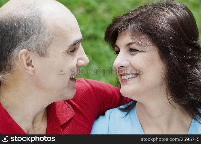 Close-up of a mature couple looking at each other and smiling